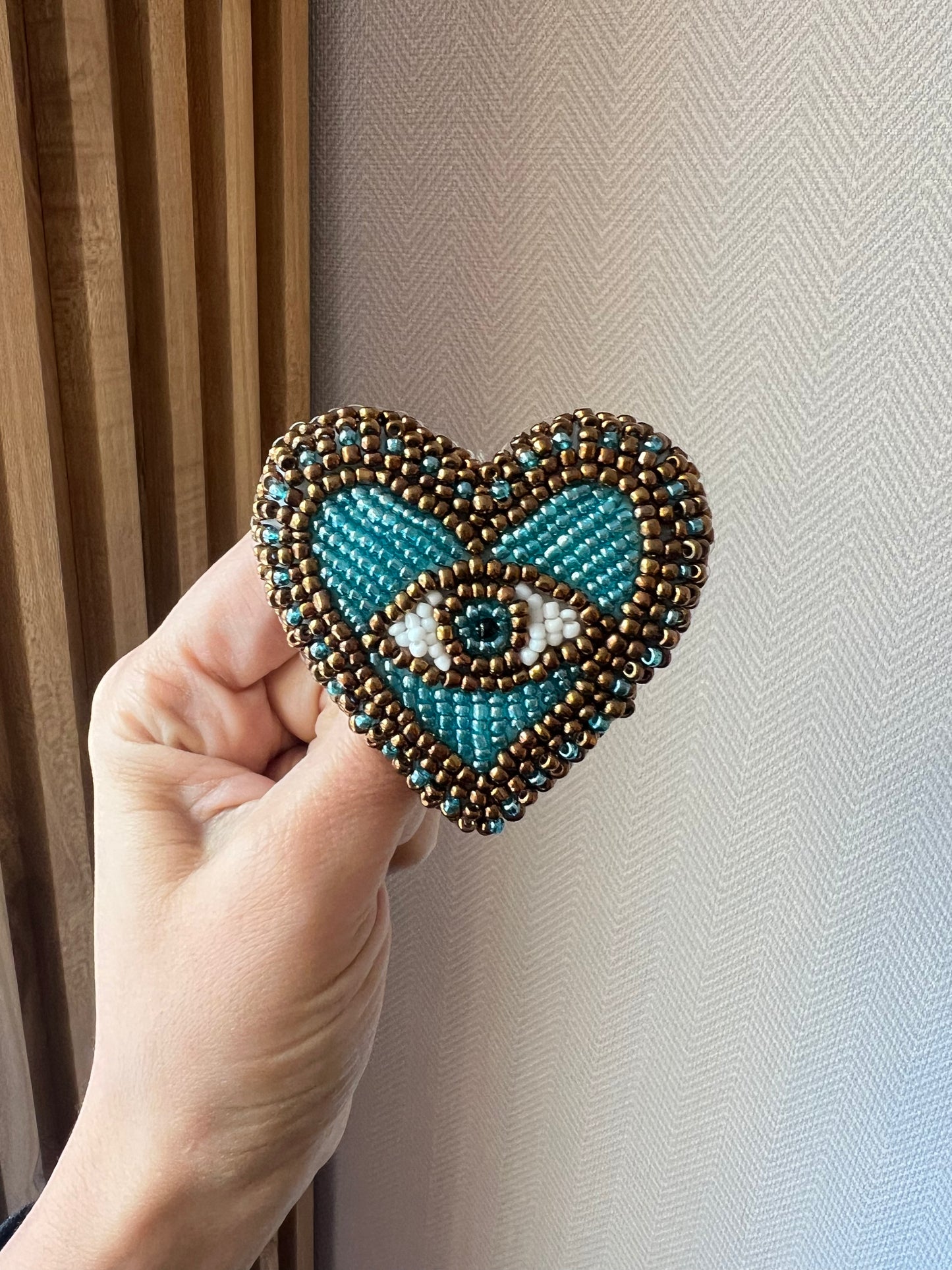 Heart eye brooch